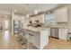 Modern kitchen with granite countertops, stainless steel appliances, and barstool seating at 2793 Nature View Rd, St Cloud, FL 34771