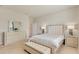 Serene main bedroom with a padded headboard, neutral colors, and a comfortable bench at 2793 Nature View Rd, St Cloud, FL 34771