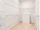 Walk-in closet with wire shelving and a chest of drawers for optimal storage at 2793 Nature View Rd, St Cloud, FL 34771