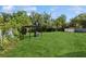 Home features a huge grassy backyard with storage shed and covered patio at 2822 Fulford St, Deltona, FL 32738