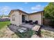 Home features a cozy backyard with a brick patio and fire pit at 2822 Fulford St, Deltona, FL 32738