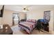 Bedroom featuring a ceiling fan and a large window at 2822 Fulford St, Deltona, FL 32738