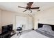 Bright bedroom features ceiling fan, closet, and neutral color scheme at 2822 Fulford St, Deltona, FL 32738