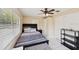 Comfortable bedroom with fan, windows, closet, and neutral wall and ceiling colors at 2822 Fulford St, Deltona, FL 32738