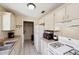 Functional kitchen with white cabinets, appliances, and durable countertops at 2822 Fulford St, Deltona, FL 32738