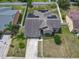 Stunning aerial view of property and driveway with a solar panel roof in a gated community at 2860 Orange Haven Way, Kissimmee, FL 34746