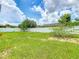 Spacious backyard features a well-maintained lawn with a tall white fence, offering privacy at 2860 Orange Haven Way, Kissimmee, FL 34746