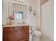 Bathroom featuring a vanity with a sink and faucet, a toilet, and a shower with a white shower curtain at 2860 Orange Haven Way, Kissimmee, FL 34746