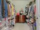 Walk-in closet with custom shelving and ample storage space at 2860 Orange Haven Way, Kissimmee, FL 34746