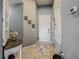 Inviting entryway with tiled floors, decorative console table, and neutral paint, creating a welcoming atmosphere at 2860 Orange Haven Way, Kissimmee, FL 34746