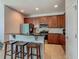 Features bar seating, stainless steel appliances, and tiled flooring in this modern-style kitchen at 2860 Orange Haven Way, Kissimmee, FL 34746