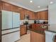 Features stainless steel appliances, tiled flooring, and dark counter tops with bar seating at 2860 Orange Haven Way, Kissimmee, FL 34746