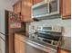 This modern kitchen features stainless steel appliances and stunning backsplash at 2860 Orange Haven Way, Kissimmee, FL 34746