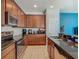 The kitchen has stainless steel appliances, plenty of cabinet space, and dark countertops at 2860 Orange Haven Way, Kissimmee, FL 34746