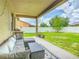 Covered patio area with outdoor seating, perfect for relaxing and entertaining at 2860 Orange Haven Way, Kissimmee, FL 34746
