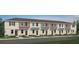 Charming townhome featuring a two-story facade, neutral colors, and well-manicured landscaping enhancing curb appeal at 3073 Skyline Loop, Kissimmee, FL 34758
