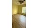 Bedroom featuring hard surface floors and a window offering natural light at 30965 E Thyme Ave, Eustis, FL 32736