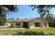 Charming one-story home with a lush green lawn and well-maintained landscaping at 30965 E Thyme Ave, Eustis, FL 32736