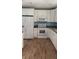 Bright kitchen features white cabinets, appliances, and lots of countertop space at 30965 E Thyme Ave, Eustis, FL 32736