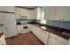 Bright kitchen features white cabinets, appliances, and lots of countertop space at 30965 E Thyme Ave, Eustis, FL 32736