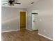 Living room with hardwood floors, a ceiling fan, and an open layout at 30965 E Thyme Ave, Eustis, FL 32736