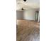 Spacious living room showcasing wood-look flooring and ample natural light at 30965 E Thyme Ave, Eustis, FL 32736