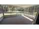 Screened in back patio with views of the yard and trees at 30965 E Thyme Ave, Eustis, FL 32736