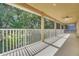 This balcony is perfect for relaxing and enjoying the outdoors, with ample seating and stunning views at 33919 Terragona Dr, Sorrento, FL 32776