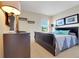 Comfortable bedroom with a sleigh bed, neutral colors, and tranquil decor for a relaxing retreat at 33919 Terragona Dr, Sorrento, FL 32776