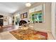 Cozy dining area with large windows, modern table set, and stylish décor at 33919 Terragona Dr, Sorrento, FL 32776