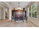 Formal dining area featuring natural light, a decorative shelf, and contemporary furniture at 33919 Terragona Dr, Sorrento, FL 32776