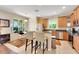 Bright kitchen featuring stainless steel appliances, wood cabinets, and a cozy breakfast nook area at 33919 Terragona Dr, Sorrento, FL 32776