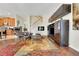 Spacious living room with modern entertainment center, comfortable seating, and stylish decor with hardwood floors at 33919 Terragona Dr, Sorrento, FL 32776