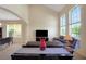 Open living room with tall windows providing lots of natural light, and an easy flow into the other living spaces at 33919 Terragona Dr, Sorrento, FL 32776
