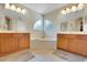 This main bathroom features dual sinks, a soaking tub, and a separate shower for added convenience at 33919 Terragona Dr, Sorrento, FL 32776