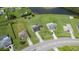 High angle aerial view of the property showing the home’s location and proximity to a scenic pond at 3600 Fountainbleu Blvd, Kissimmee, FL 34746