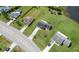 Scenic aerial view of the property with a long driveway, mature trees, and landscaping at 3600 Fountainbleu Blvd, Kissimmee, FL 34746