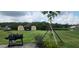 Large backyard featuring a grill and two storage sheds with plenty of space for outdoor activities at 3600 Fountainbleu Blvd, Kissimmee, FL 34746