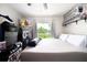A basic bedroom with tile flooring, closet shelving, and a window offering a view of the lawn at 3600 Fountainbleu Blvd, Kissimmee, FL 34746