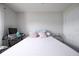 A simple bedroom, features minimal decor with a workspace to include a computer and tile flooring at 3600 Fountainbleu Blvd, Kissimmee, FL 34746