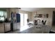 Sunlit dining area featuring modern chandelier and stainless steel appliances at 3600 Fountainbleu Blvd, Kissimmee, FL 34746