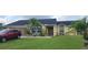 Charming single-story home with a well-manicured lawn and beautiful landscaping at 3600 Fountainbleu Blvd, Kissimmee, FL 34746