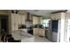 Bright kitchen with custom cabinets, stainless steel appliances, and a marble countertop island at 3600 Fountainbleu Blvd, Kissimmee, FL 34746