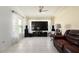 Comfortable living room with tiled floors, lots of natural light, and ceiling fan at 3600 Fountainbleu Blvd, Kissimmee, FL 34746