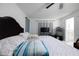 Comfortable main bedroom featuring tile flooring, fan, and closet at 3600 Fountainbleu Blvd, Kissimmee, FL 34746