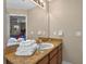Bathroom featuring granite counters, a sink, and a view into an adjacent bedroom at 3725 Calabria Ave, Davenport, FL 33897