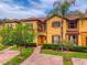Exterior of a home showcasing manicured landscaping, a walkway, and a two-story facade at 3725 Calabria Ave, Davenport, FL 33897