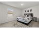 A bedroom featuring a bed with a patterned comforter, and a window at 391 Begonia Ct, Kissimmee, FL 34759