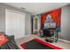 A bedroom with gray walls, gray carpet, a large closet, and a sofa at 391 Begonia Ct, Kissimmee, FL 34759