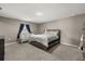 Serene bedroom with a cozy bed, a crib, and soft lighting, creating a relaxing atmosphere at 391 Begonia Ct, Kissimmee, FL 34759